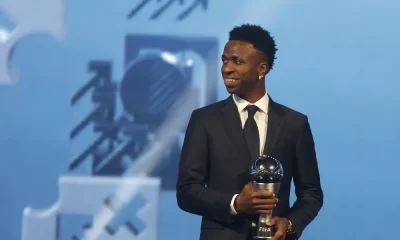 vinicius junior poses with the best player trophy during the best fifa