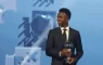 vinicius junior poses with the best player trophy during the best fifa